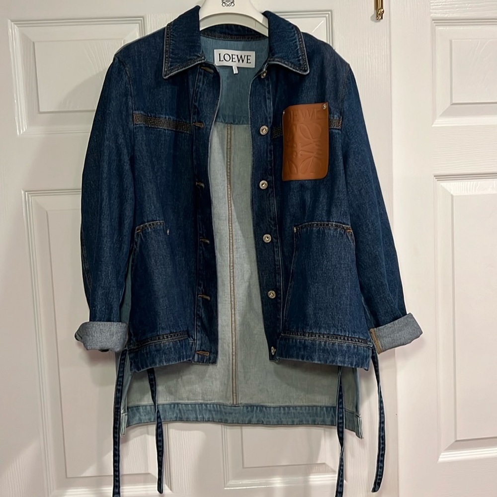Loewe denim jacket with leather anagram pocket. 2 color denims and ties on sides